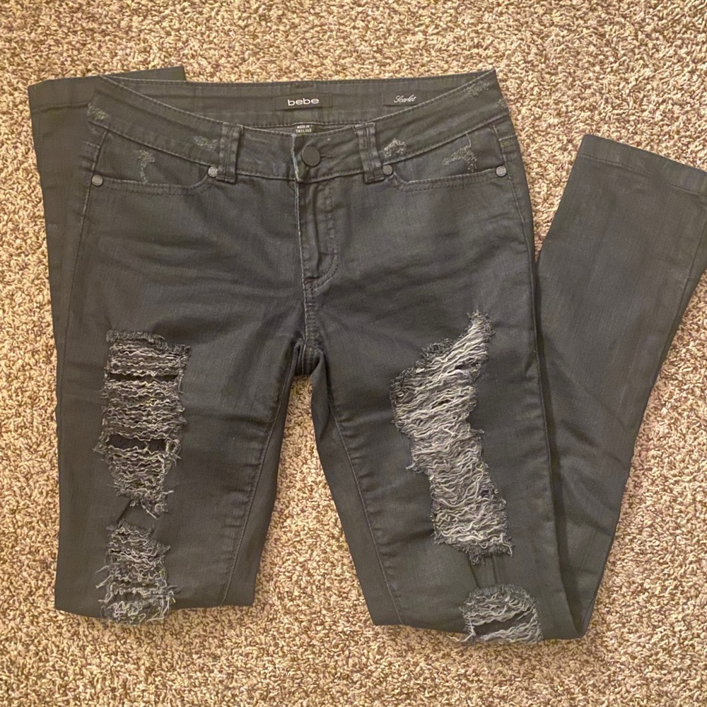 Bebe scarlet jeans with distressed front panels, fishnet lining inside jeans